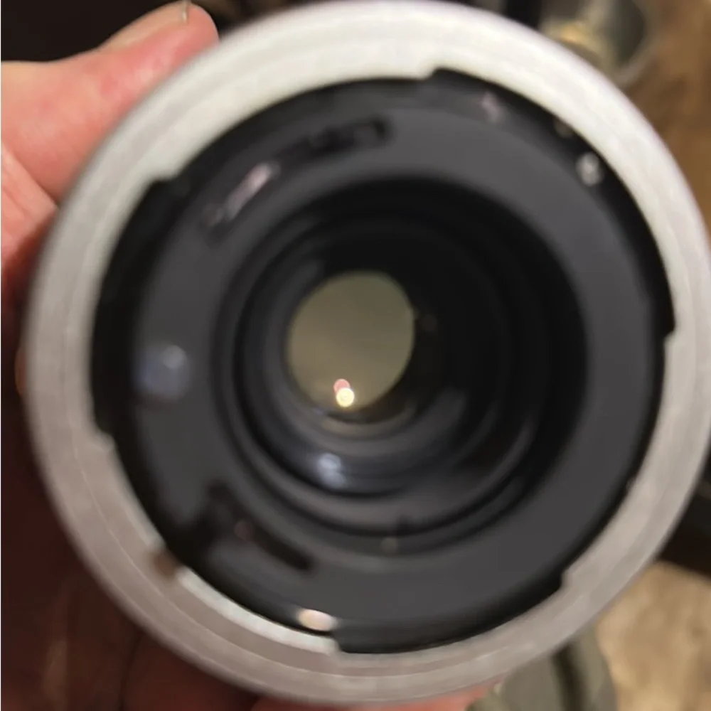 Two lenses one made by canon one made by prinz in box
